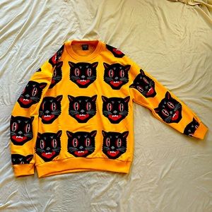 Men’s SAW yellow cat sweater. Size medium